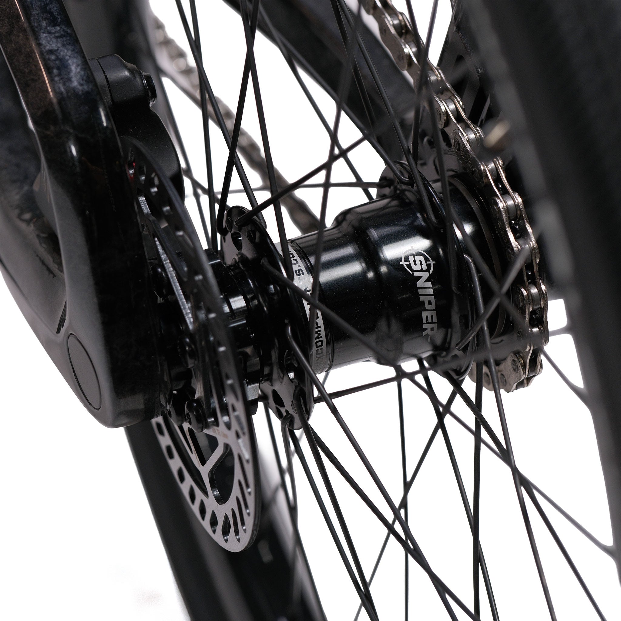 Close-up of a bicycle wheel hub labeled "SNIPER," showing black spokes, disc brake rotor, and part of the gear cassette on a white background—designed to perfectly complement the Meybo HSX Carbon Pro XXL Race Bike.