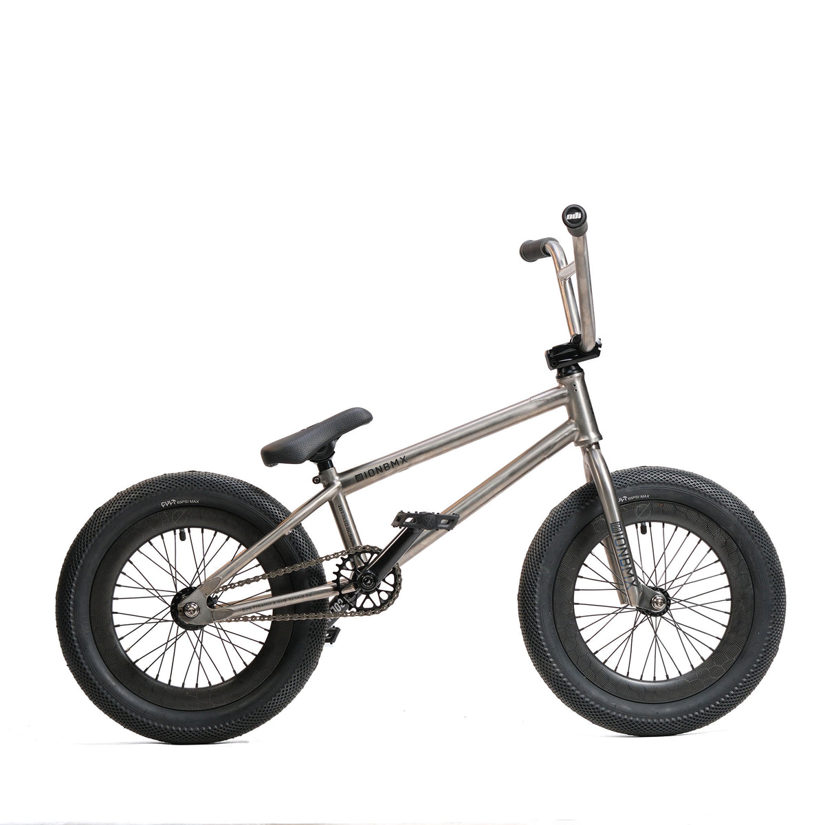 The ION BMX Ti16 Custom Titanium 16 Inch Bike, featuring a lightweight metallic frame, large wide tires, black seat, and handlebars, is shown in profile on a white background.