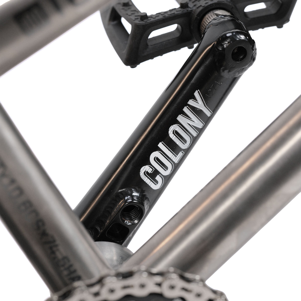 Close-up of a black crank arm with the word “COLONY” in silver, mounted on the ION BMX Ti16 Custom Titanium 16 Inch Bike—highlighting the precision components typical of lightweight BMX setups.