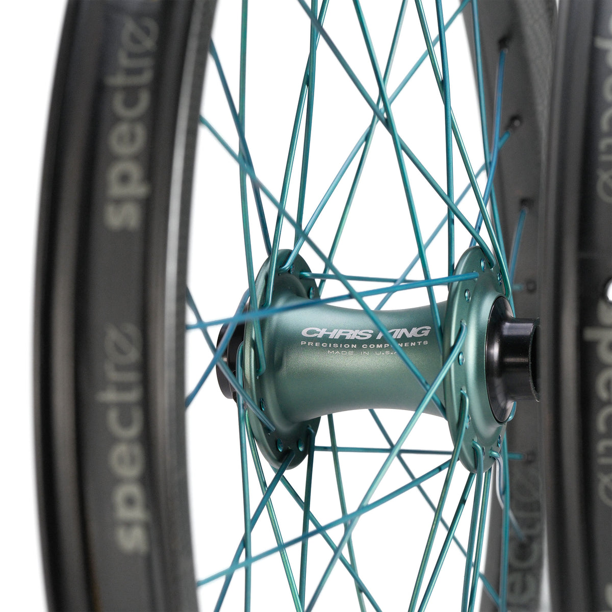 Chris King X Spectre NME Custom 20inch Wheel Set featuring a teal hub and matching spokes connected to a black rim with “Spectre” lettering.