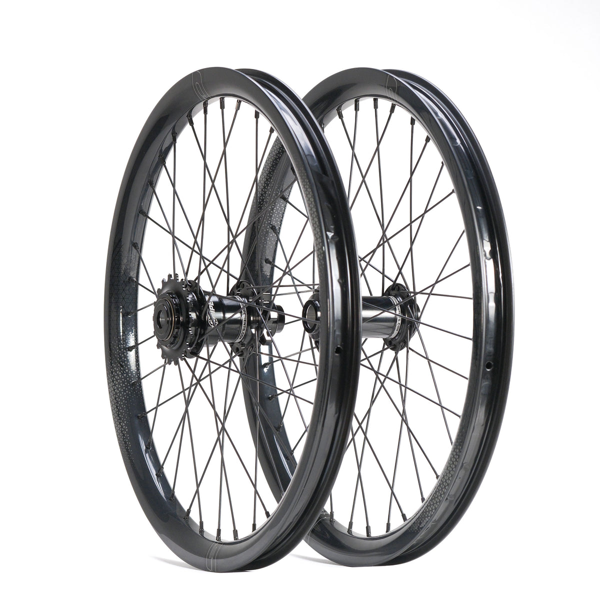 Two black M58 V2 rims with thin spokes and SD-X Sniper Evo Pro hubs, displayed as an SD-X Sniper Evo Pro x SD-X M58 V2 20inch Wheel Set, positioned one behind the other against a white background.