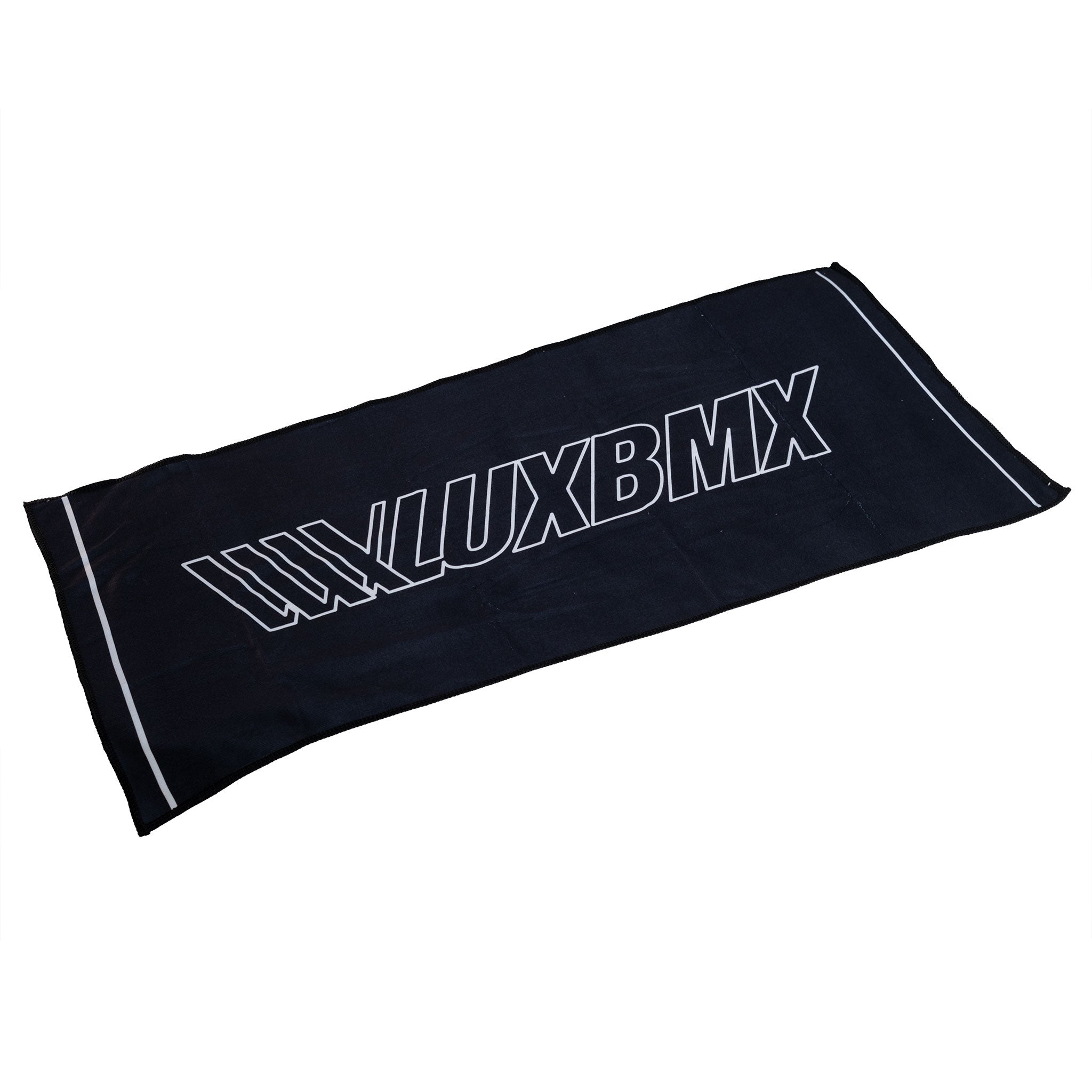 The LUXBMX Sweat Towel is a black microfibre towel with "LUXBMX" in large white letters across the center and white stripes on the short ends. Its quick-dry design makes it ideal for workouts or rides.