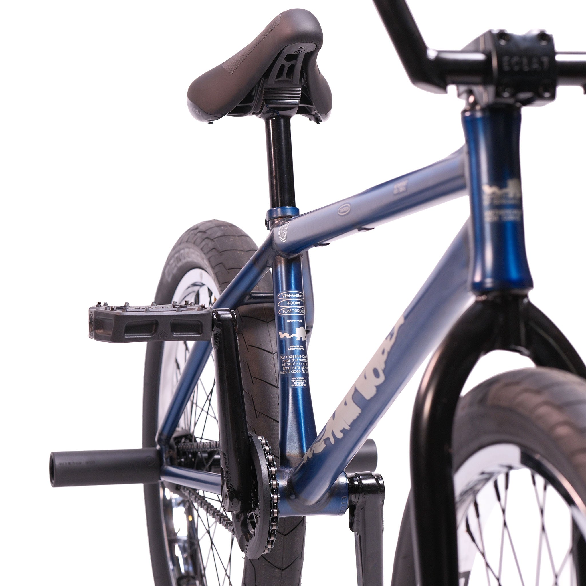 Close-up view of the Wethepeople Tomorrow X TA Custom build BMX bike, highlighting its seat, frame, rear wheel, pedal, and stunt peg against a white background.