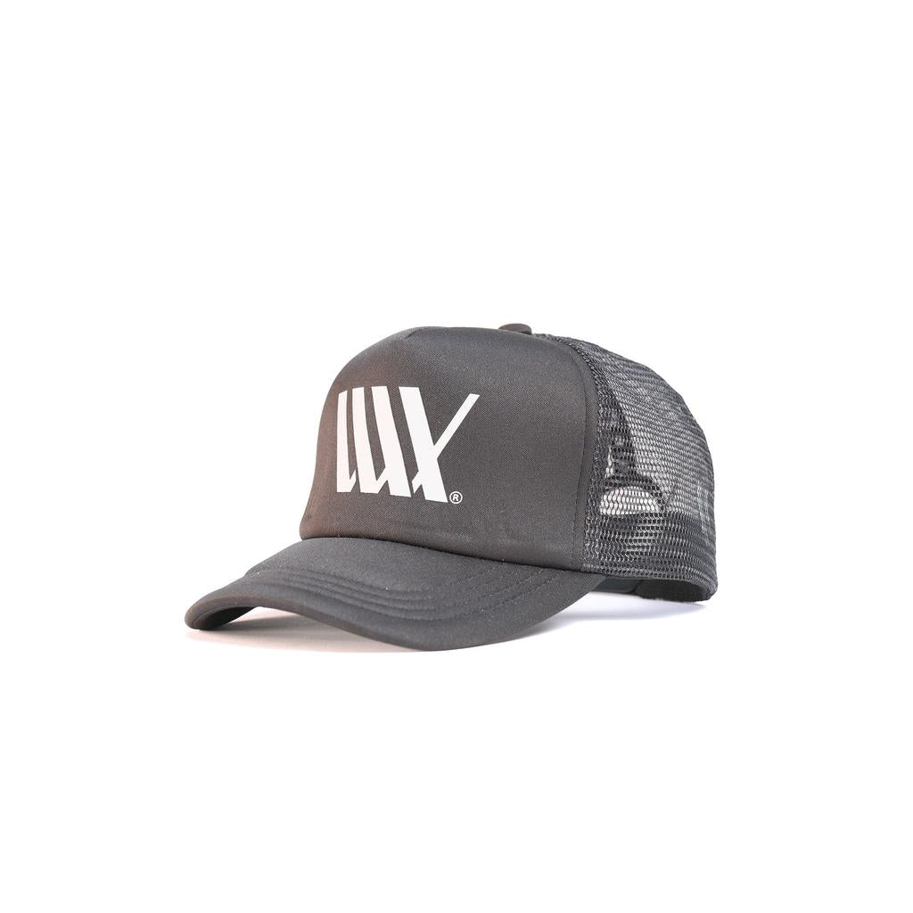The LUXBMX Flag Trucker Cap is a black mesh hat made from recycled polyester, featuring a curved bill and bold white "LUX" logo on the front—ideal for sunny days in Brisbane.
