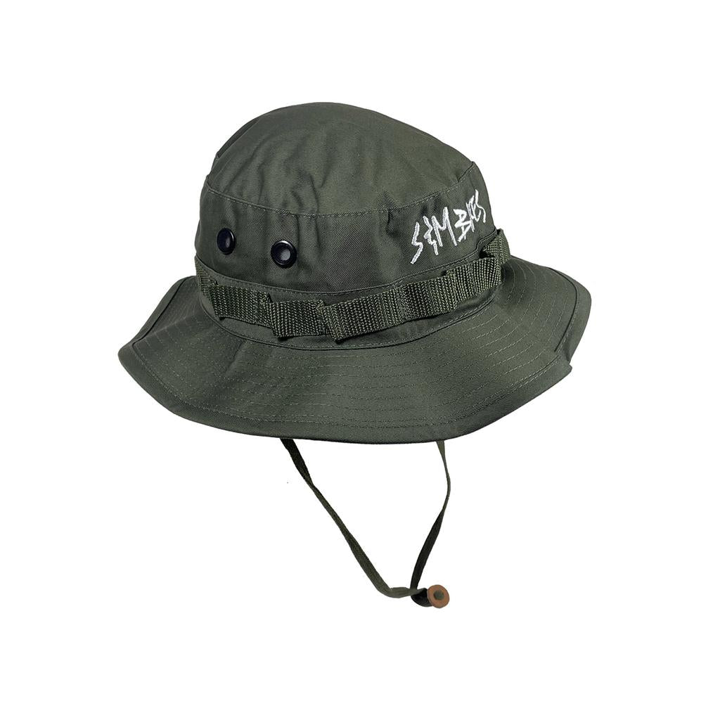 The S&M Boonie Bucket Hat is an olive green military-style sun hat with a chin strap, side ventilation eyelets, and white embroidered crown text—ideal for outdoor adventures.