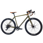 The FAIRDALE 27.5" Weekender Nomad Bike, shown in olive green with a sturdy chromoly frame, brown handlebar tape and saddle, black wheels, wide knobby tires, and disc brakes—profile view on white background.