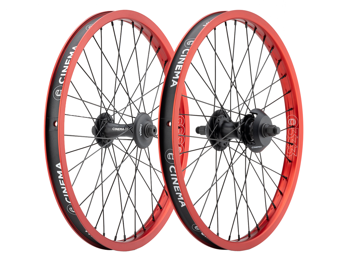 Cinema 333/ZX 20 Inch Wheel Set with black spokes and red rims featuring white branding.