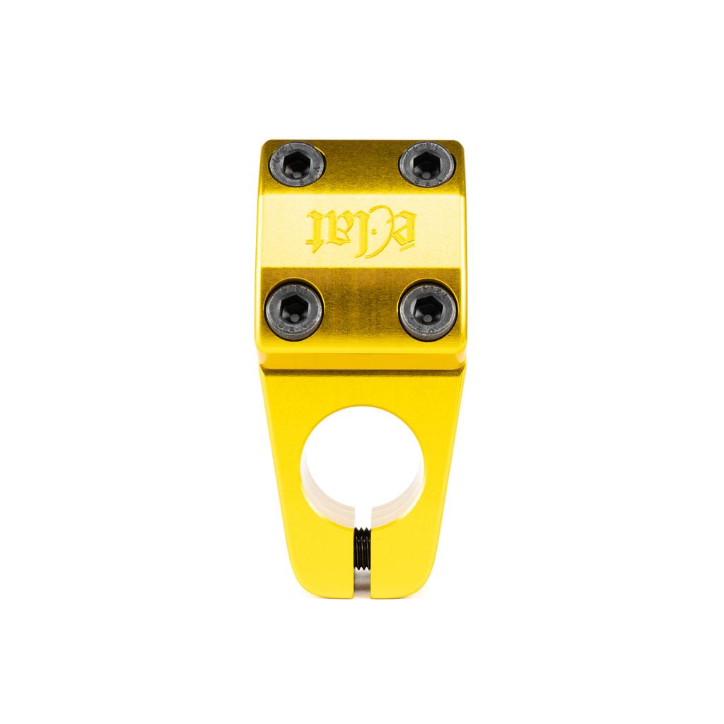 The Eclat 1023 Stem is a gold BMX stem with mid-school styling, four black bolts, and a CNC-machined faceplate engraved with "WL," as seen from the front.
