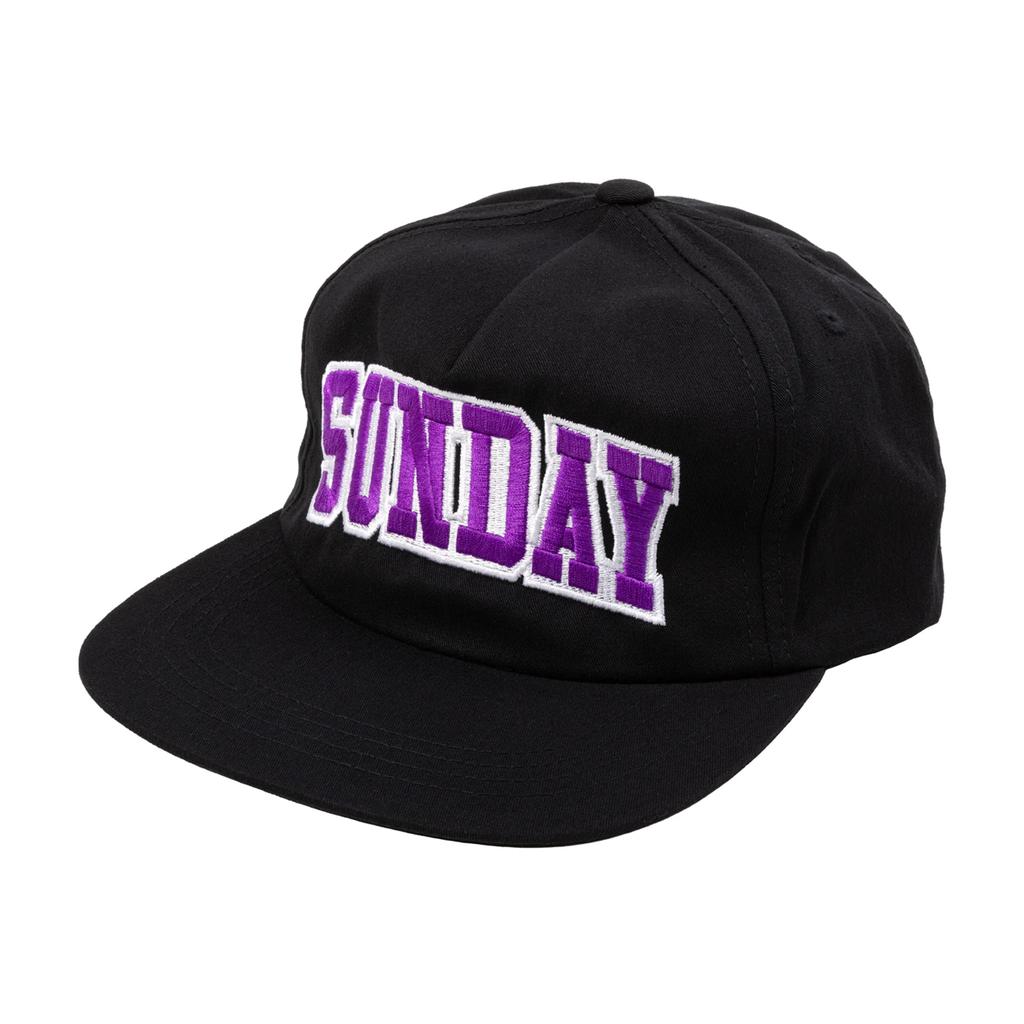 The Sunday Blockhead Cap is a black baseball cap with "SUNDAY" displayed in bold purple and white letters on the front.