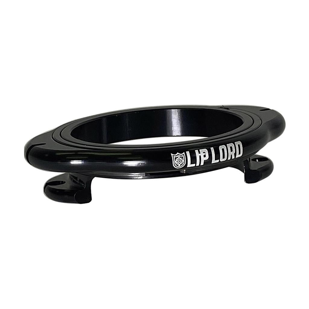 The S&M Lip Lord Mobeus Gyro Rotor is a black, circular CNC-machined billet alloy device labeled "LIP LORD," featuring two hooks at its base and a small graphic, shown on a white background.