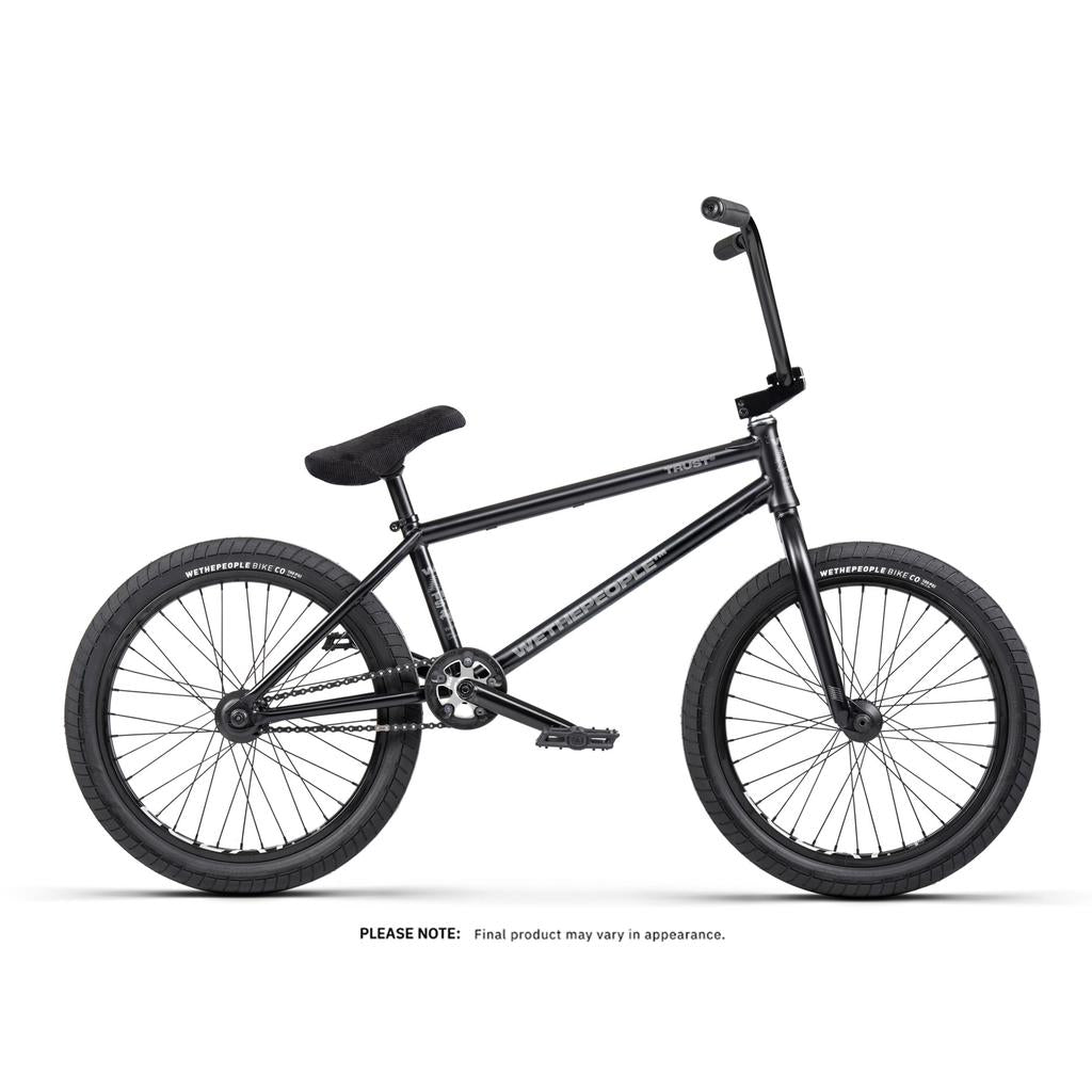 Black Wethepeople Trust 20 Inch Freecoaster/Hybrid Bike with thick tires, straight handlebars, and a padded seat on a white background. Ideal for street upgrades. Final product appearance may vary.