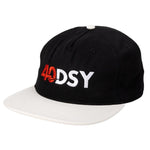 The Odyssey 40DSY Cap is a black and white baseball cap featuring "40DSY" embroidered in bold white and red—an essential piece from our holiday collection.