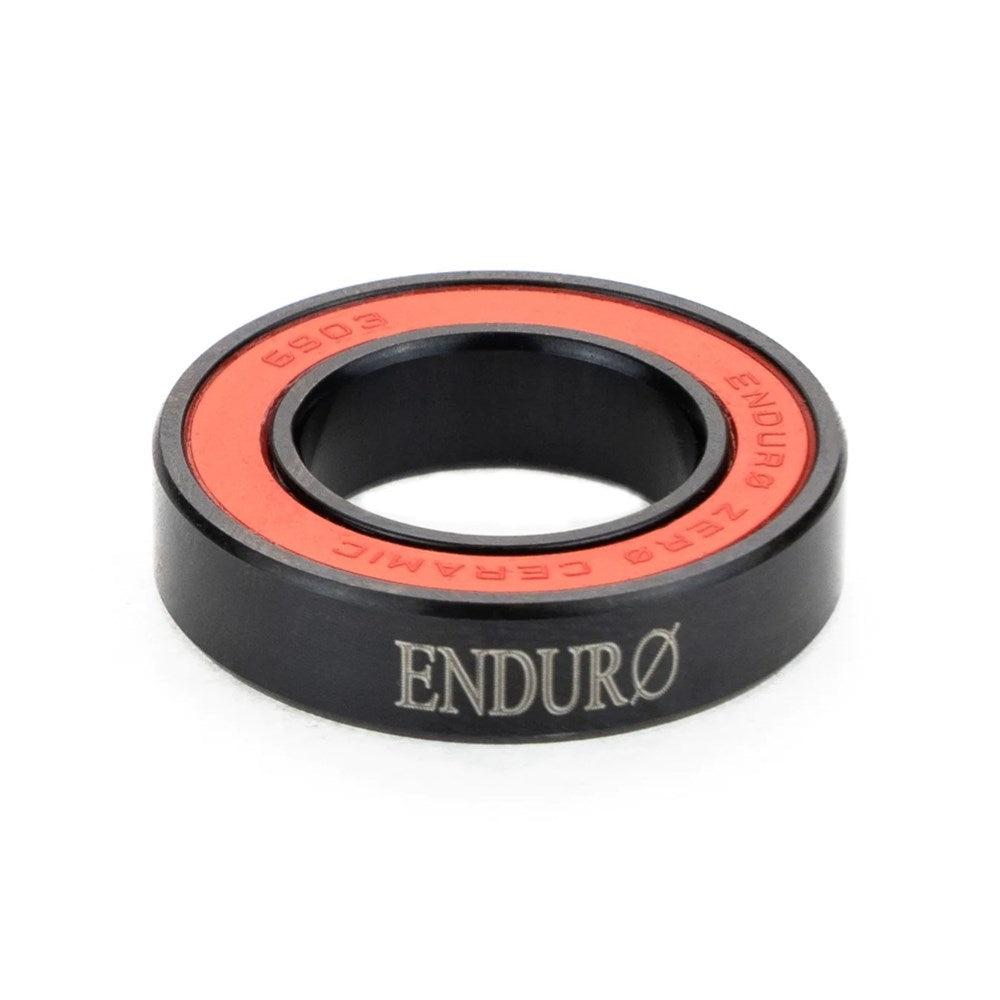 Enduro ZERO Ceramic Sealed Bearing (each) branded ZERØ Ceramic bearing with black exterior and red interior showcases low rolling resistance, the perfect race day weapon on a white background.