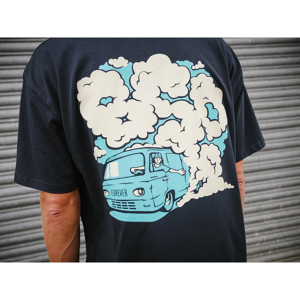 A person wearing a BSD Burnout T-Shirt, made from lightweight cotton, showcasing a graphic of a blue van with playful cartoon smoke clouds.