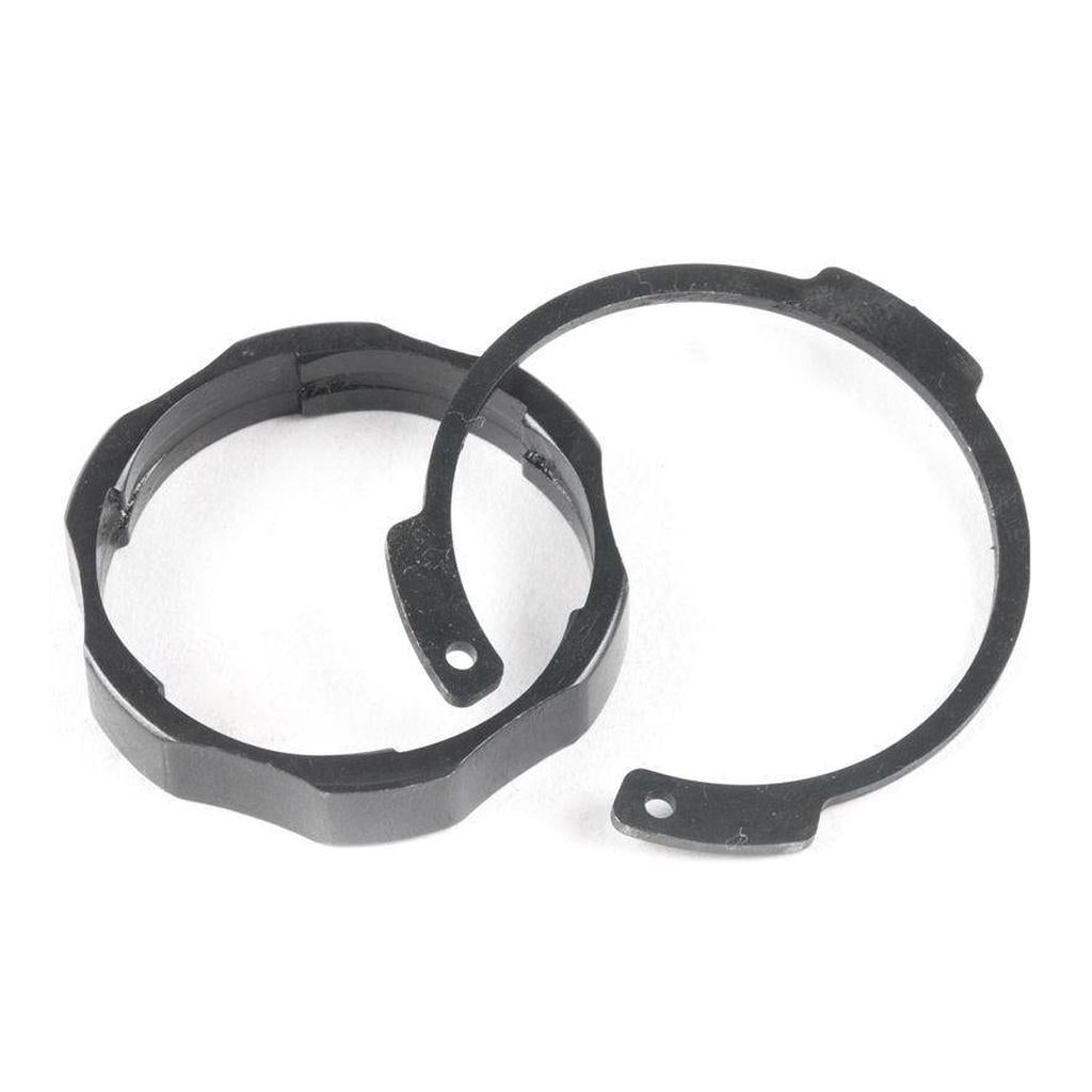 The ECLAT Blind Freecoaster Spline Ring & C Clip, featuring a black metal circular c-clip with two holes and a split ring with an uneven edge, are shown on a white background—ideal replacement parts for blind free coaster hubs.