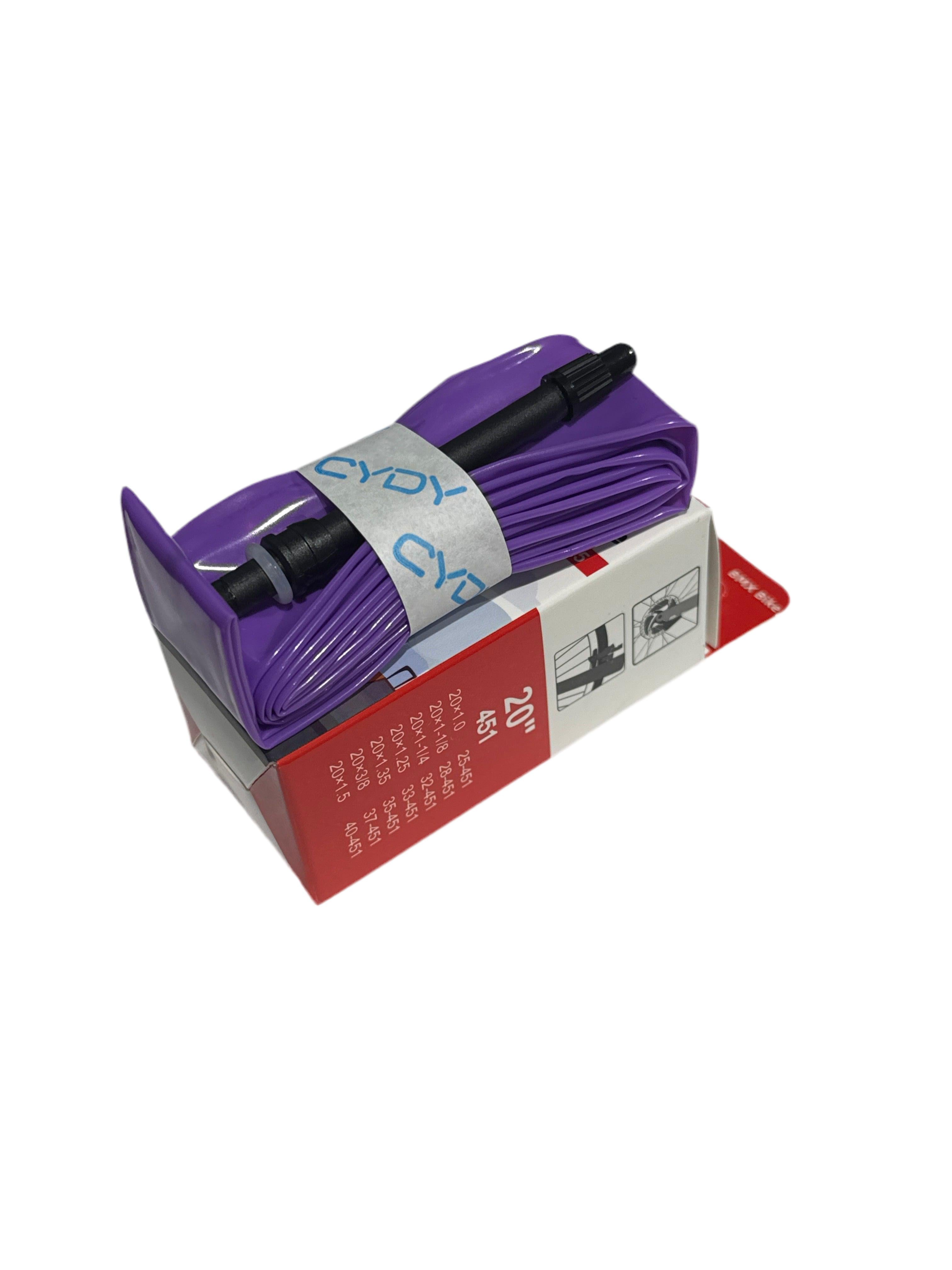 The CYDY TPU 20 Inch Inner Tube, featuring a purple design with a black valve, is folded and set atop a red and white box—highlighting this ultra-light bike tube option for 20-inch bikes.