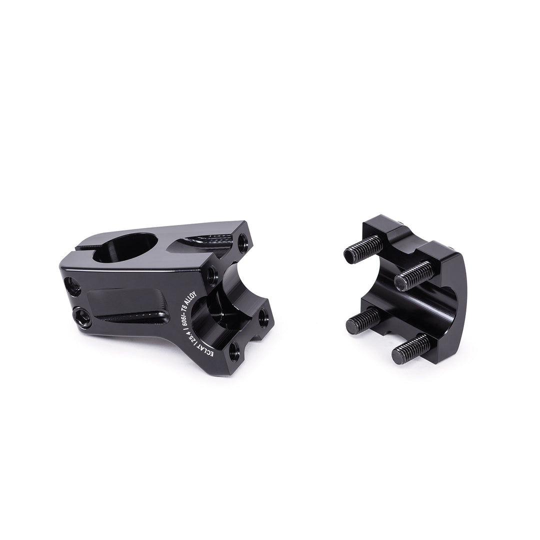 The Eclat Domain OS Front Load Stem (25.4mm Clamp) is a black, CNC-machined aluminum stem in two parts with assembly bolts, shown on a white background. This oversized stem offers strength and precision for your bike.