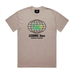 LUXBMX Eighty Eight Tee Faded Mushroom: A beige t-shirt featuring a black globe graphic, green hand symbol, "LUXBMX Store" text, and "Brisbane Australia" printed below the design—a subtle nod to Brisbane’s vibrant spirit and its iconic World Expo 88 heritage.