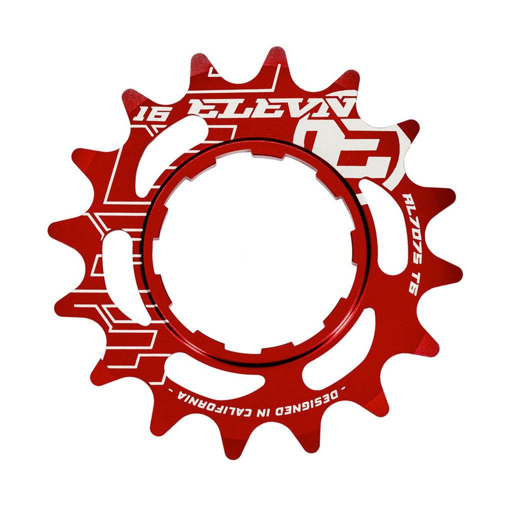 Red anodized Elevn Alloy Cog 3/32 Shimano Comp bicycle cog with white branding text, isolated on a white background.