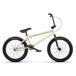 The Wethepeople Arcade 20 Inch BMX Bike is shown in beige with black handlebars, seat, pedals, and tires. Featuring Salt Parts, this mid-tier BMX balances style and quality for enthusiasts. Displayed in profile on a white background.