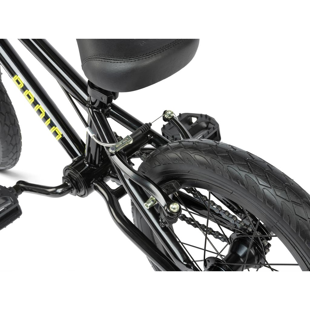 Close-up of the Radio Revo 14 Inch bike's rear wheel highlights the brake, tire, pedals, and seat—perfect details for anyone looking for their first BMX bike.