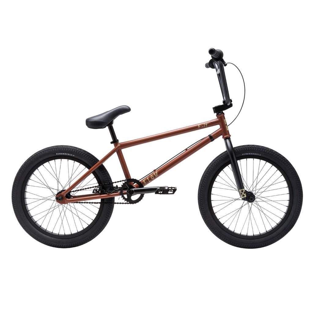 A Fit Bike Co Flow 20 Inch bike in brown with black handlebars, seat, pedals, and tires is displayed side view against a white background.