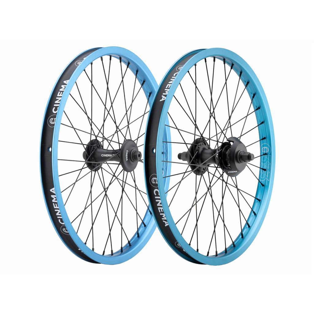 Cinema 333/ZX 20 Inch Wheel Set with light blue 20-inch rims, black spokes, and black hubs.