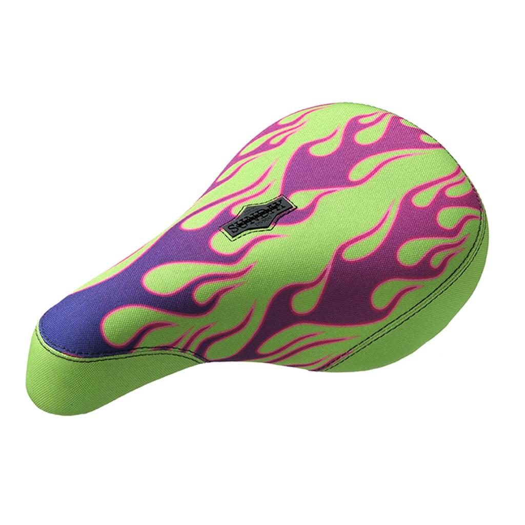 The Sunday Lava Flames Pivotal Seat features a neon green and purple flame design with a visible black and white brand label, adding standout style to your bike.