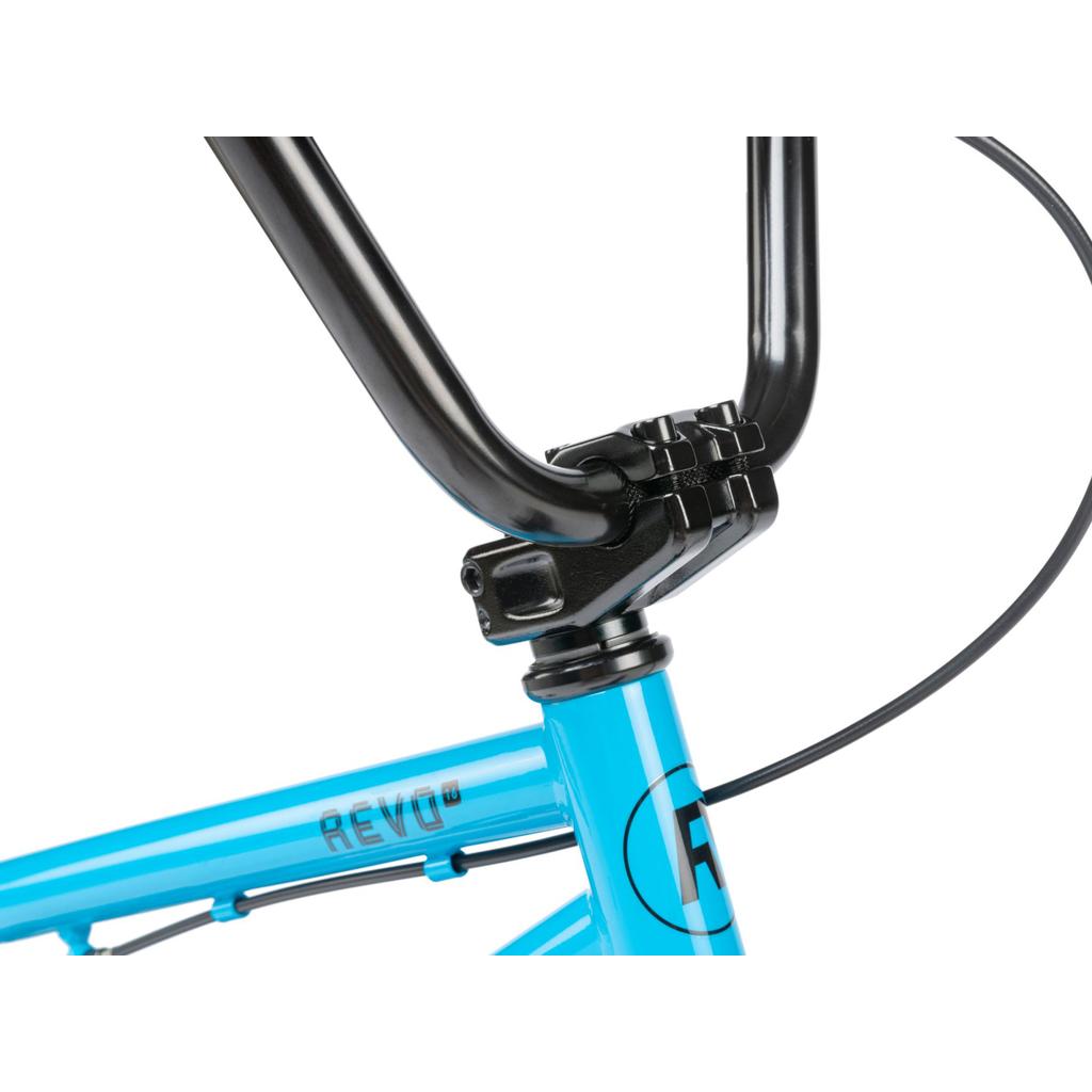 Close-up of the black handlebar and stem on a blue Radio Revo 16 Inch Bike frame with "REVO" printed on it—an ideal children's outdoor bicycle.