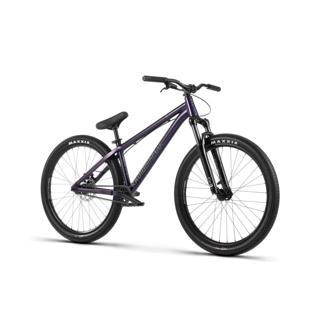 A Radio Griffin 26 Inch Bike in purple with front suspension, black handlebars, Tektro Disc Brakes, and Maxxis DTH Tyres is displayed against a white background.