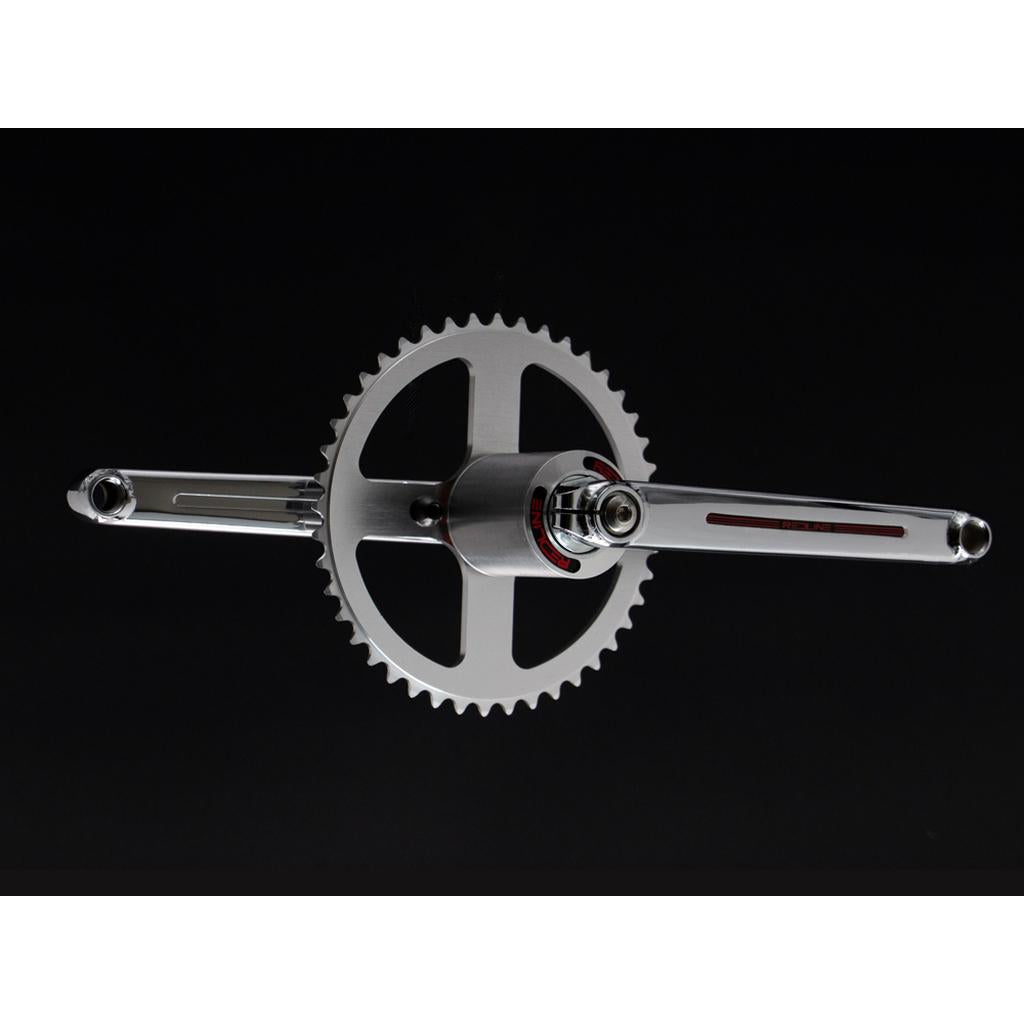 A close-up of a Redline Vintage Flight 401 Crank Set, featuring two metallic crank arms and a single chainring, set against a black background.