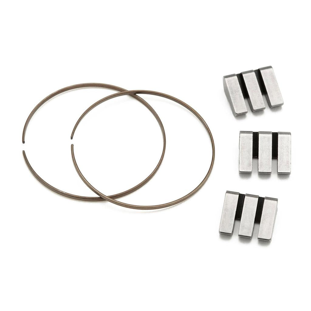 Two metal circlips and six rectangular metal parts with black grooves are arranged on a white background, forming the Cinema ZX Rear Hub Pawl Kit—ideal as replacement parts for your ZX rear wheel or cassette hub.