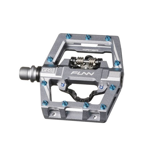 Close-up of a metal bicycle pedal with an open design, featuring blue screws and labeled "Funn Mamba S SPD," perfect for enduro racing.