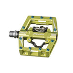Close-up of a green Funn Mamba S SPD Pedal with metallic accents and multiple blue grip pins, ideal for enduro racing.
