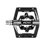 Close-up of the Funn Mamba S SPD Pedal, featuring a metal textured platform and central spring mechanism. Ideal for enduro racing, this pedal offers a symmetrical design with multiple attachment points, compatible with Shimano SPD systems.