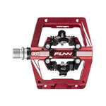 The Funn Mamba S SPD Pedal (Small Platform) is a red bicycle pedal with a metallic finish, ideal for enduro racing. It features the brand logo "Funn," plus "Mamba" and "GRS" text. It's designed for clipless cycling shoes and compatible with Shimano SPD systems, offering high performance.