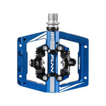 Close-up of a blue and silver Funn Mamba S SPD Pedal (Small Platform) with clip mechanism and metal axle, ideal for enduro racing, featuring "FUNN" and "MAMBA" text.