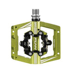 The green Funn Mamba S SPD Pedal features a sturdy metal frame and black clip compatible with Shimano SPD, ideal for enduro racing.