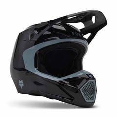 The Fox YTH V1 Taunt Helmet is a black youth BMX helmet with a visor and chin guard, angular vents, and a small fox logo—ideal for entry-level moto or mountain biking.