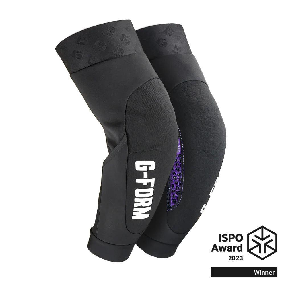 The black G-Form RE ZRO Terra Elbow Guard features a hexagonal grip pattern for superior impact protection and displays the 2023 ISPO Award Winner logo in the bottom right, part of the Terra Knee + Elbow Guards collection.