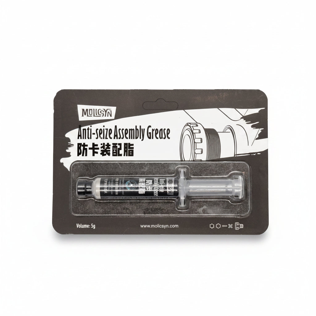 A 5g syringe of MolicSYN Prime Anti-Seize Grease, featuring black packaging and labeled in both English and Chinese, is a versatile anti-corrosion paste designed for protecting metal surfaces and threads—making it ideal for a range of applications, including use as a bike lubricant.