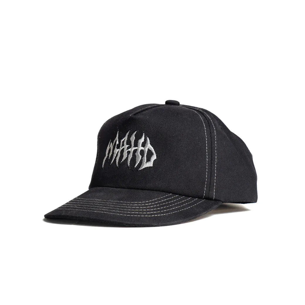The Mahd - Metal Hat is a black 5 panel cap featuring white contrast stitching and an abstract white embroidered logo on the front.