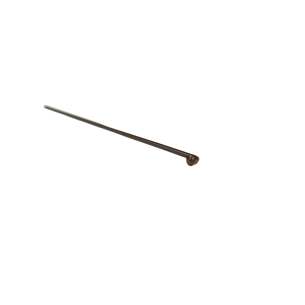 A single Spectre Titanium Spoke (Each) in Coffee, with a bent end, rests diagonally on a white sheet of paper atop a wooden surface, hinting at the meticulous start of a wheel build.