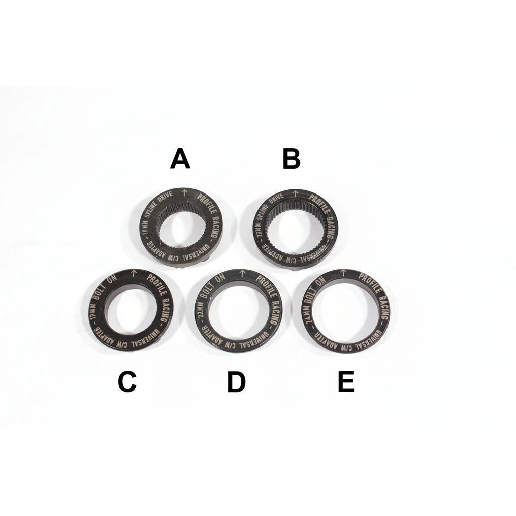 Five metal bicycle parts labeled A to E, including the Profile Sabre Sprocket Insert, are arranged in a semi-circle on a white surface, each engraved "PROFILE RACING UNIVERSAL BOTTOM BRACKET DRIVE".