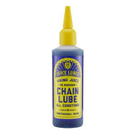 A bottle of Juice Lubes Viking Juice (Chain Lube Oil) with a yellow label and nozzle, designed for professional-grade, long-lasting bike lubrication in all conditions.