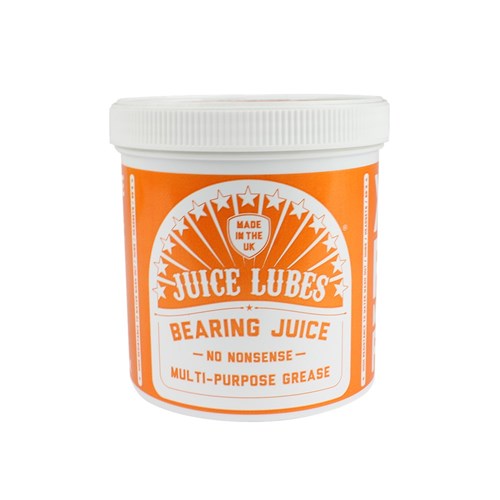 A white tub with an orange label for Juice Lubes Bearing Juice (Lithium Waterproof Grease), a UK-made bicycle grease that protects against corrosion and keeps your bike running smoothly.