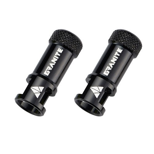 Granite Juicy - CNC Presta Valve Cap With Valve Core Remover (Pair) are displayed on a white background—two black metal valve caps with “GRANITE” branding, textured tops, and geometric white logos on the sides. These sleek bike accessories also double as convenient valve core removers.