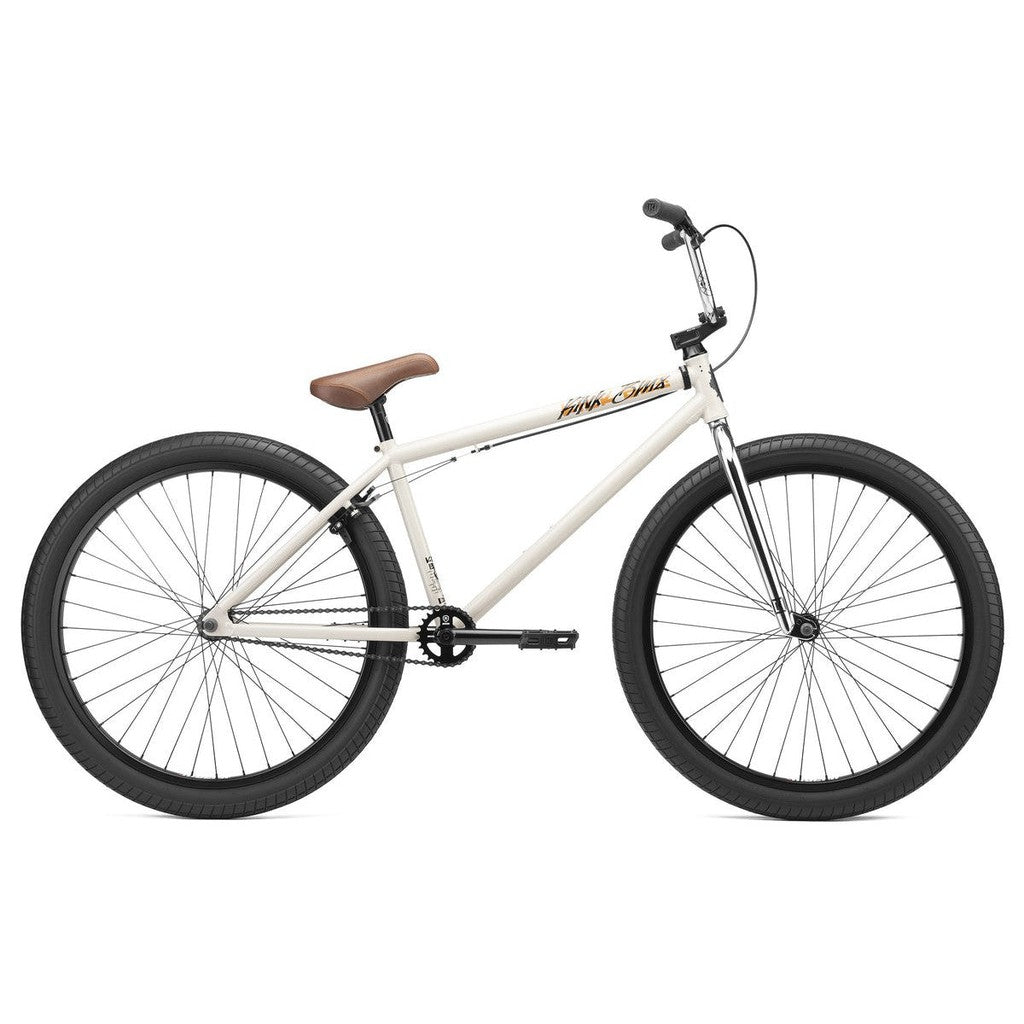 Sentence with product name: White Kink Drifter 26 Inch Bike with black wheels and a tan seat against a plain white background.