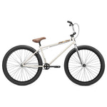 Sentence with product name: White Kink Drifter 26 Inch Bike with black wheels and a tan seat against a plain white background.