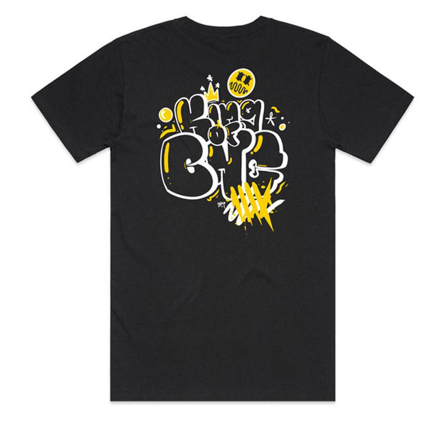 The LUXBMX King Of BNE T-Shirt honors urban street art with a vibrant graffiti-style design, showcasing "KING OF BNE" in eye-catching white and yellow abstract lettering and symbols on the back. It captures the creative spirit of Sean Gardner's dynamic artistry.